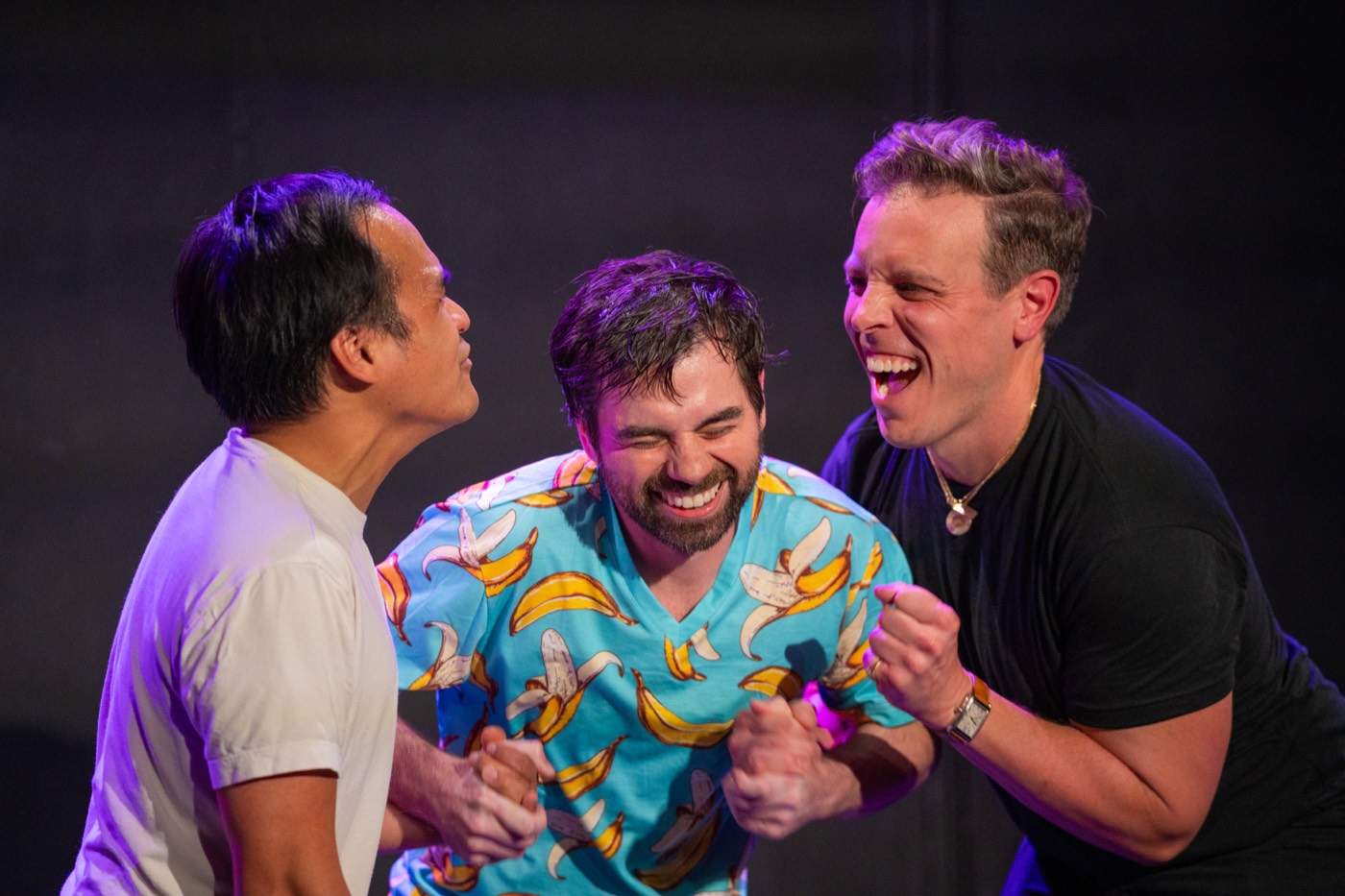 Ensemble celebrating on stage